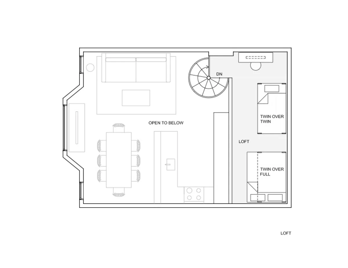 A welcoming open-plan interior with a dining table, cozy living area, and a staircase leading to more space. The setup is ideal for family meals, games, and relaxation after a day out.